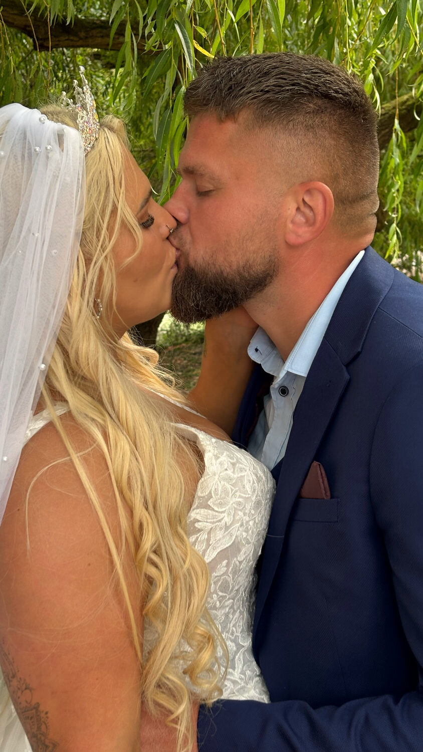 Close-up romantic photo of the bride and groom kissing